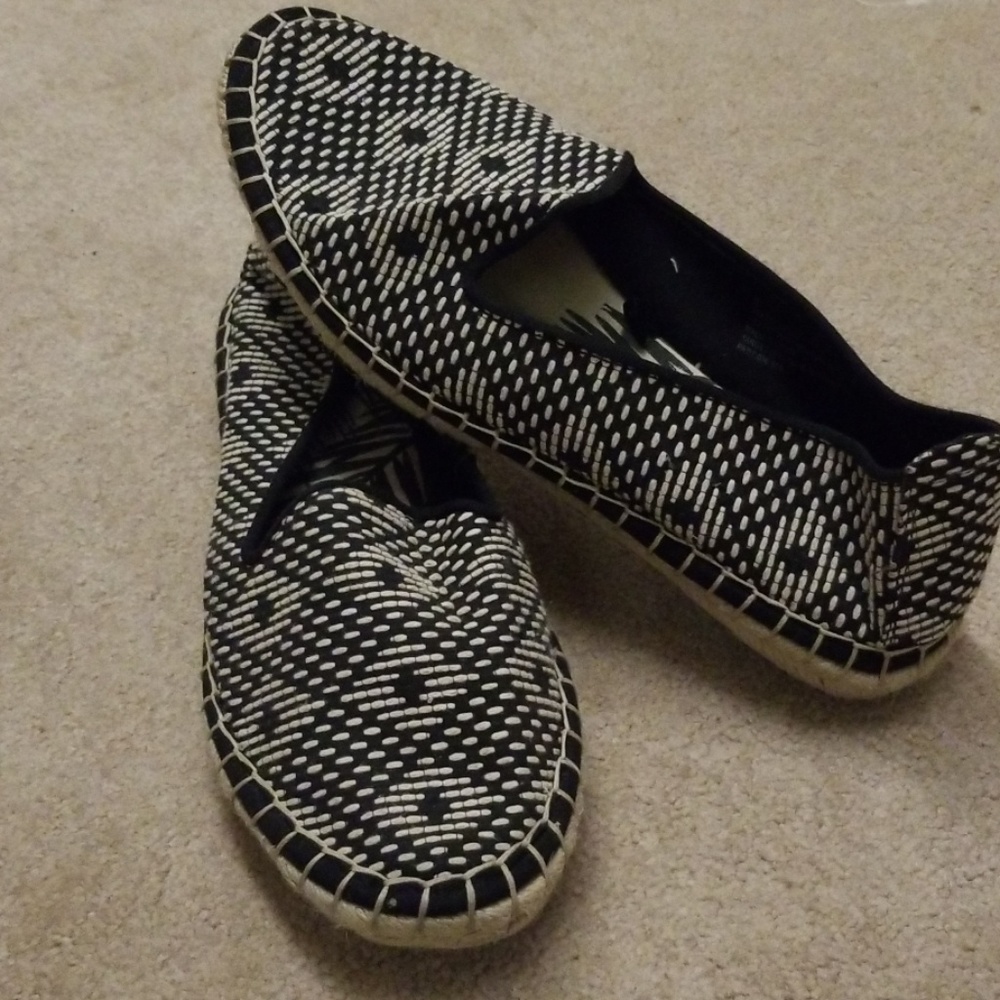 Slide on loafer.  Black and cream.